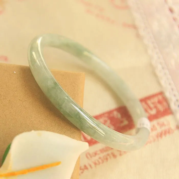 Green jade student bracelet with geometric beads showing Chinese style design and adjustable sizing options