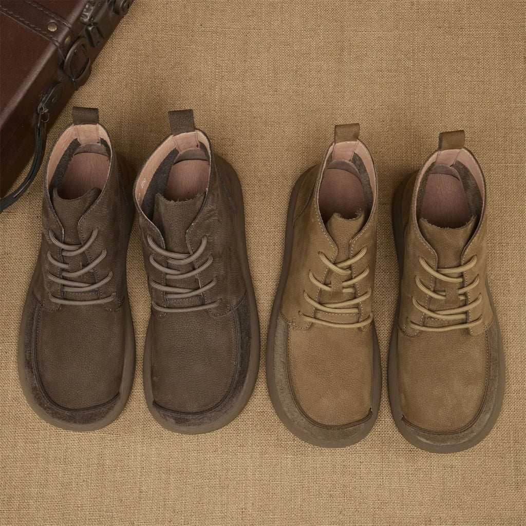 Grey genuine leather Martin boots with wedge heel and front lace-up design.
