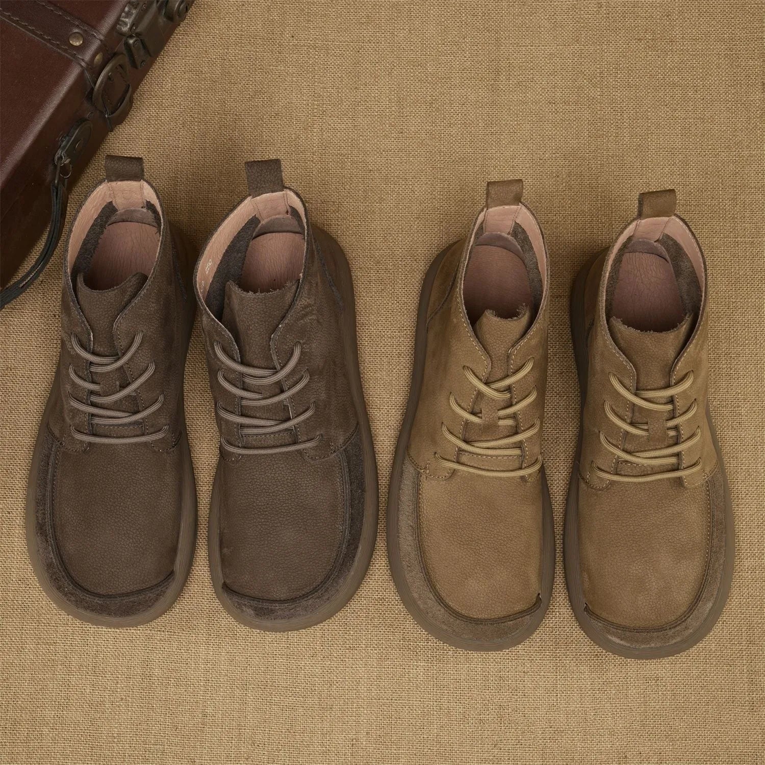 Grey genuine leather Martin boots with wedge heel and front lace-up design.