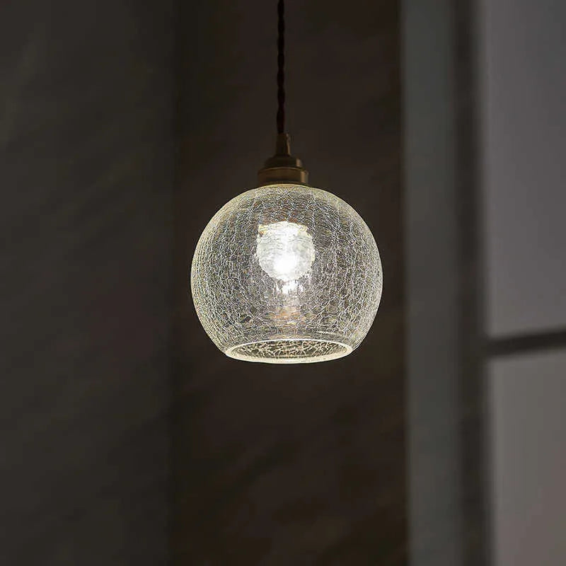 Retro brass chandelier with glass ball shade measuring 17.5cm wide by 15cm high