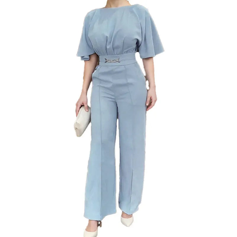 Men's blue polyester two-piece suit with long sleeve jacket and trousers on a hanger.