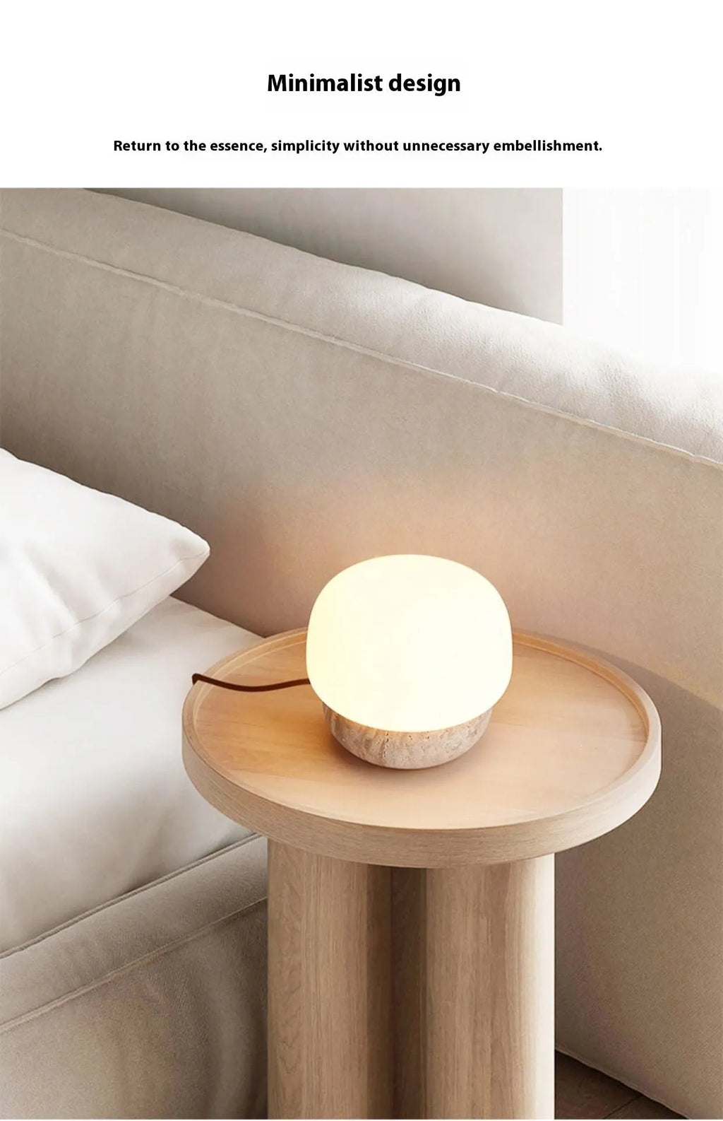 Cream coloured retro bedside lamp with a button switch on a wooden surface.