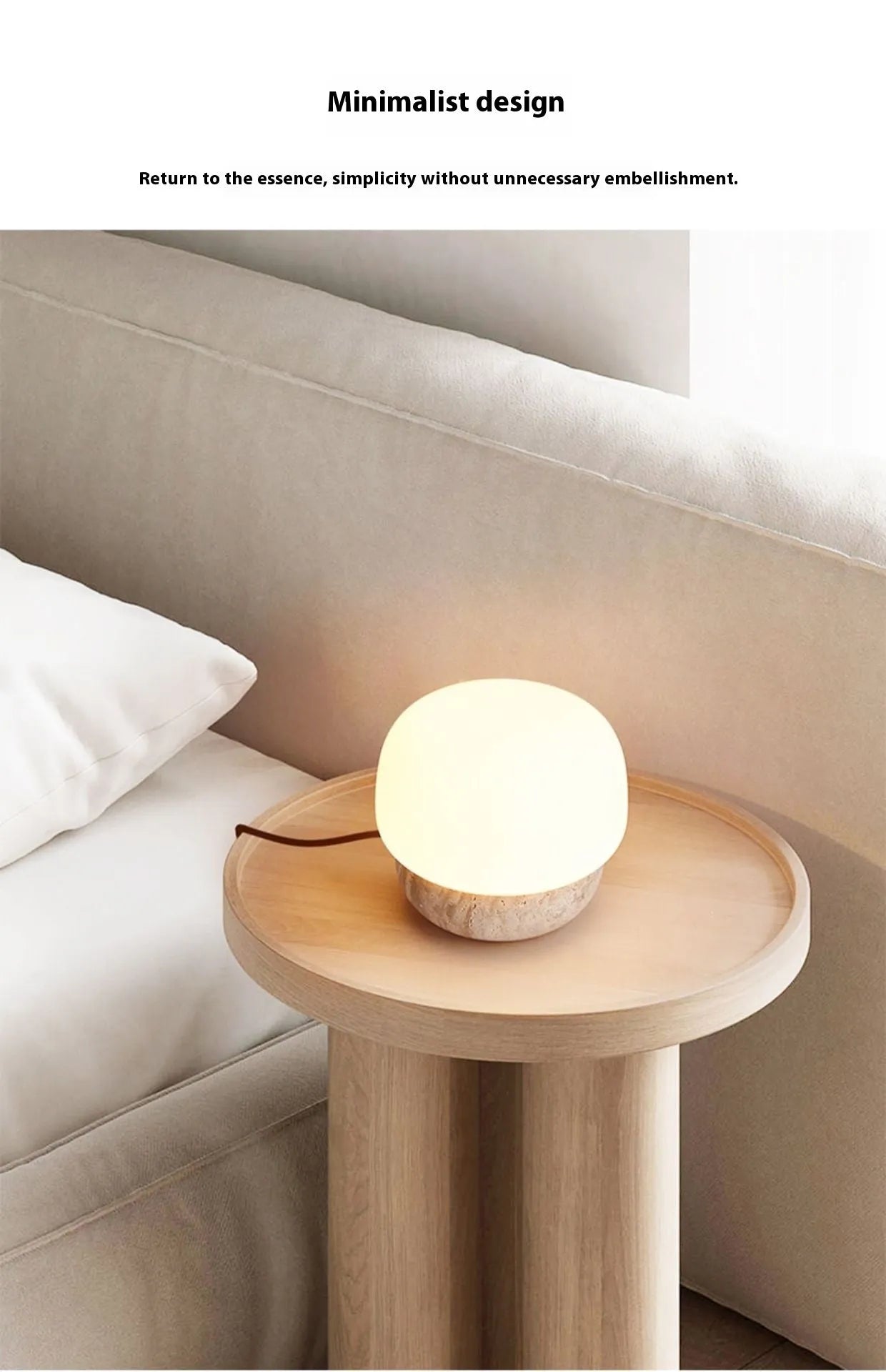 Cream coloured retro bedside lamp with a button switch on a wooden surface.