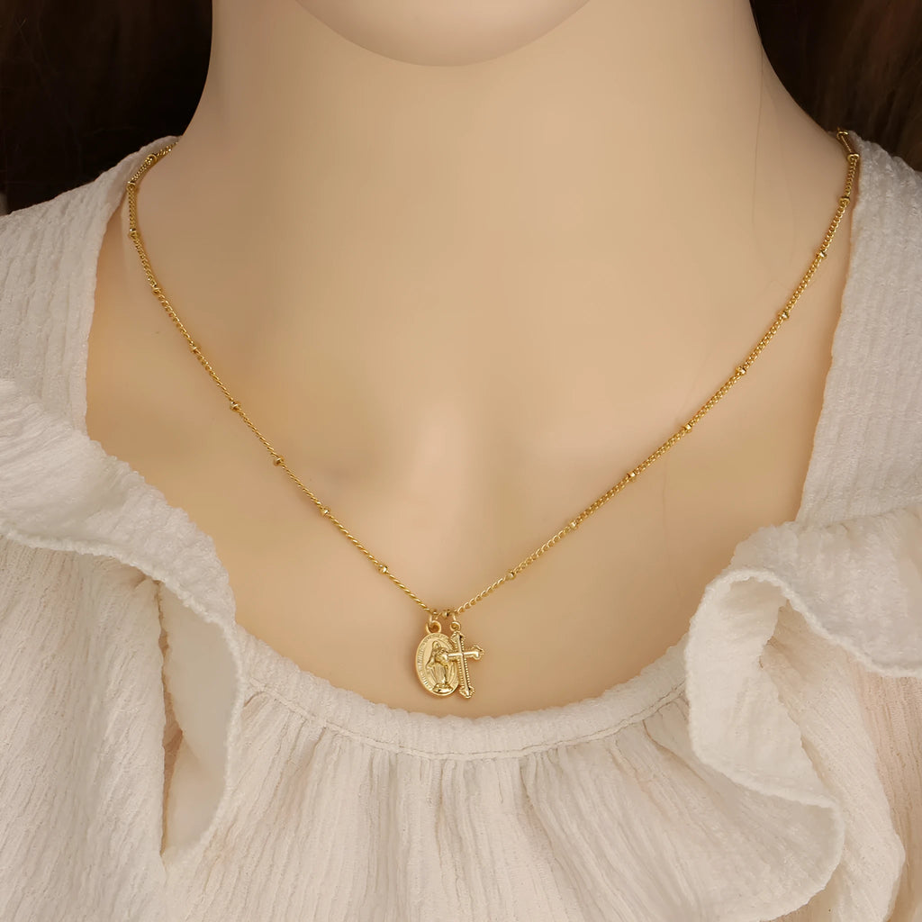 Gold Virgin Mary necklace with geometric cross pendant on copper with 18K plating