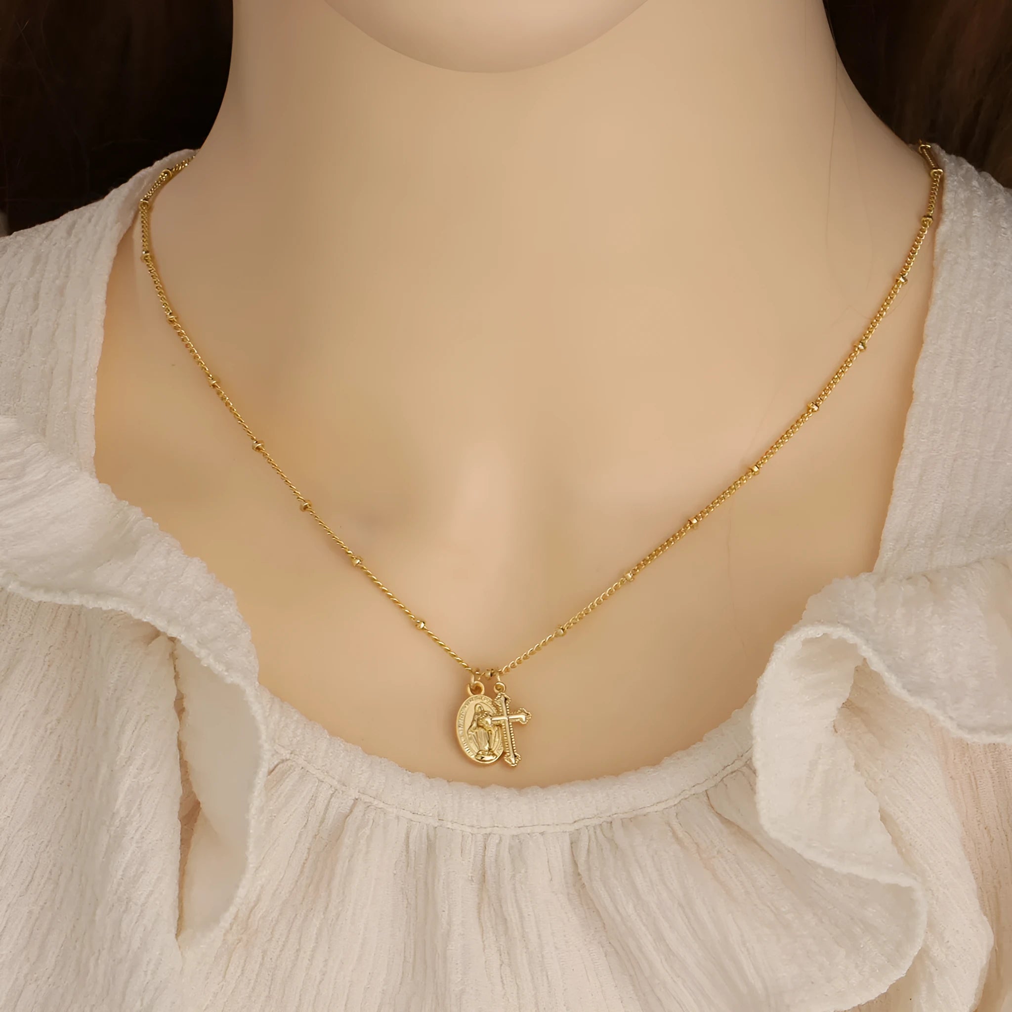 Gold Virgin Mary necklace with geometric cross pendant on copper with 18K plating