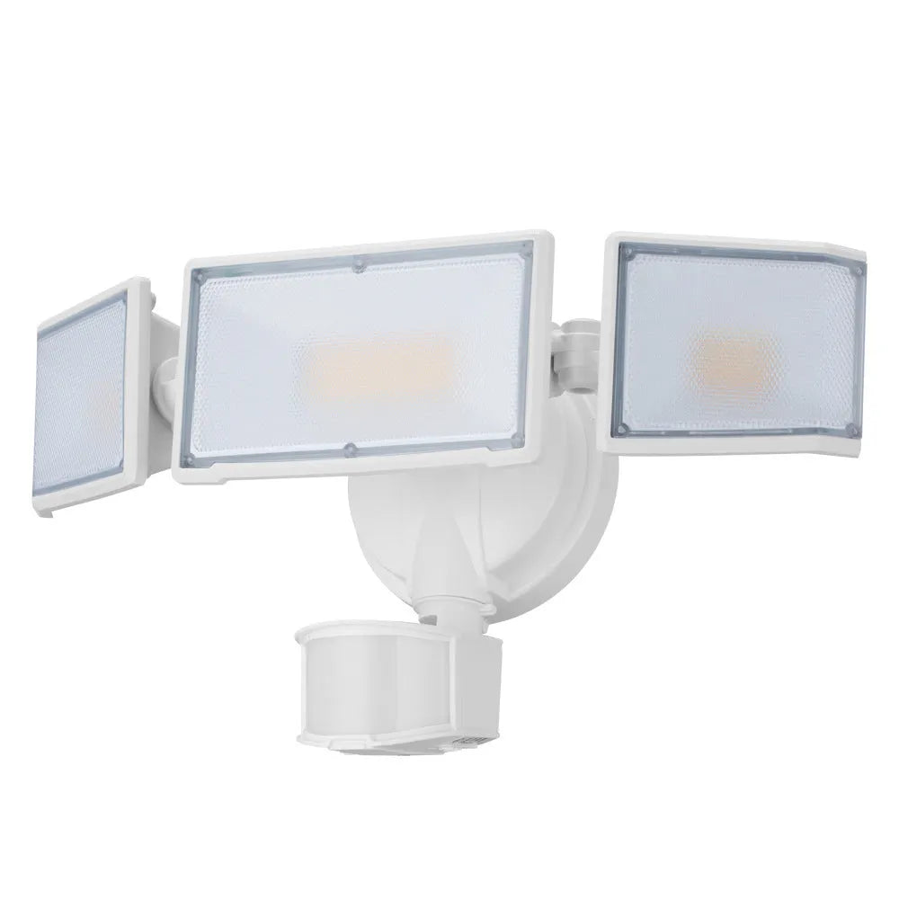 White outdoor LED security flood light with motion sensor mounted on a wall.