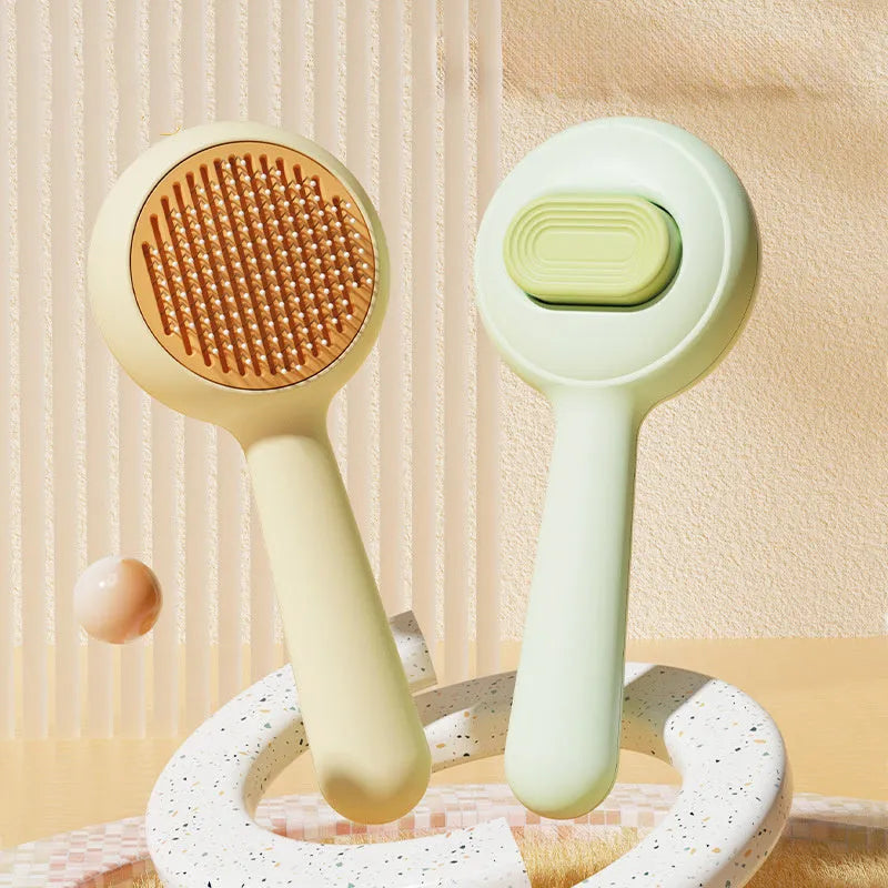 Stainless steel cat grooming brush with non-slip handle in green or yellow colour