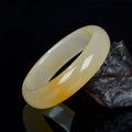 Natural light jade bracelet for women with polished finish, shown in Chinese style, with size options visible.
