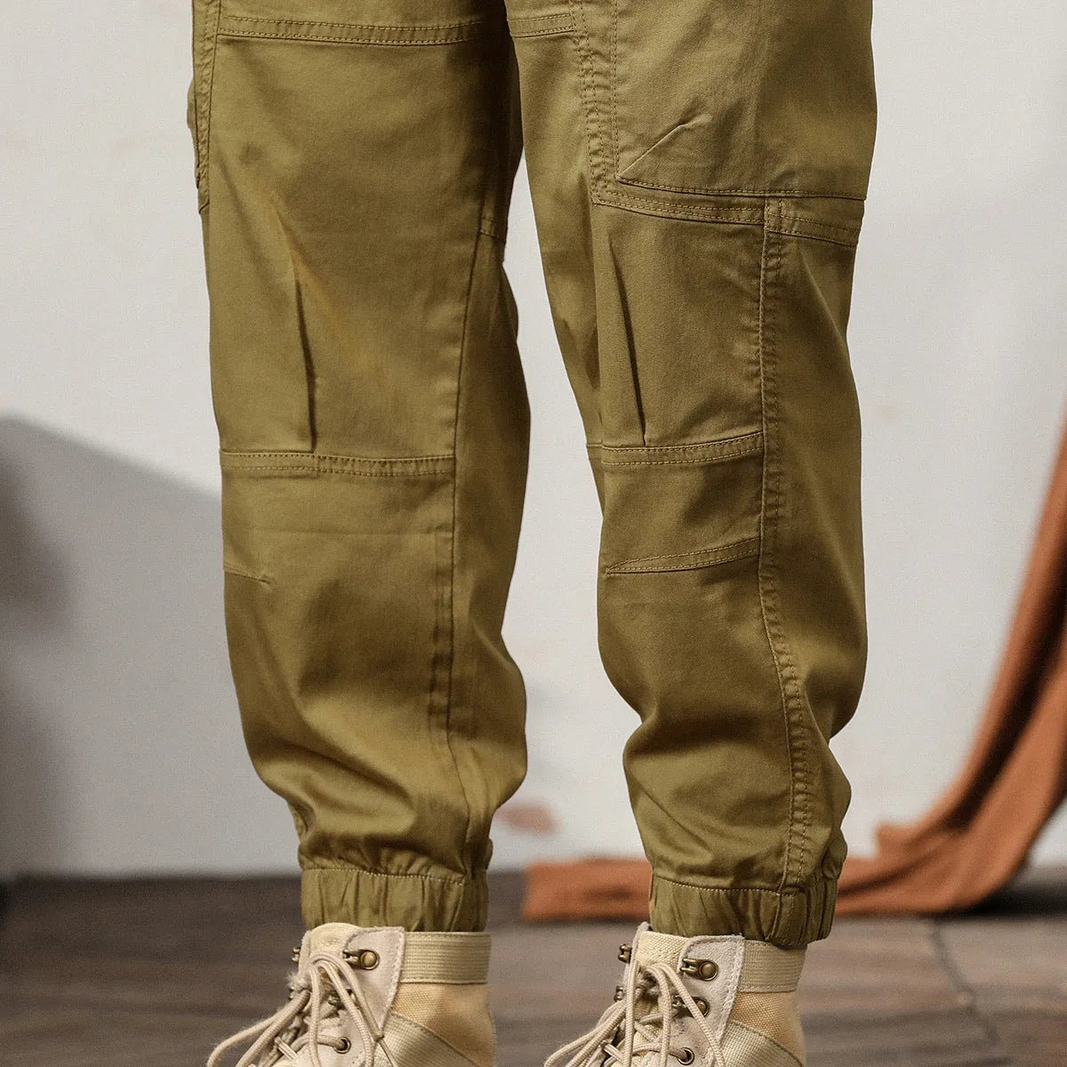 Men's loose fit khaki harem pants with ankle band and zip fly, made from non-ironing cotton fabric.