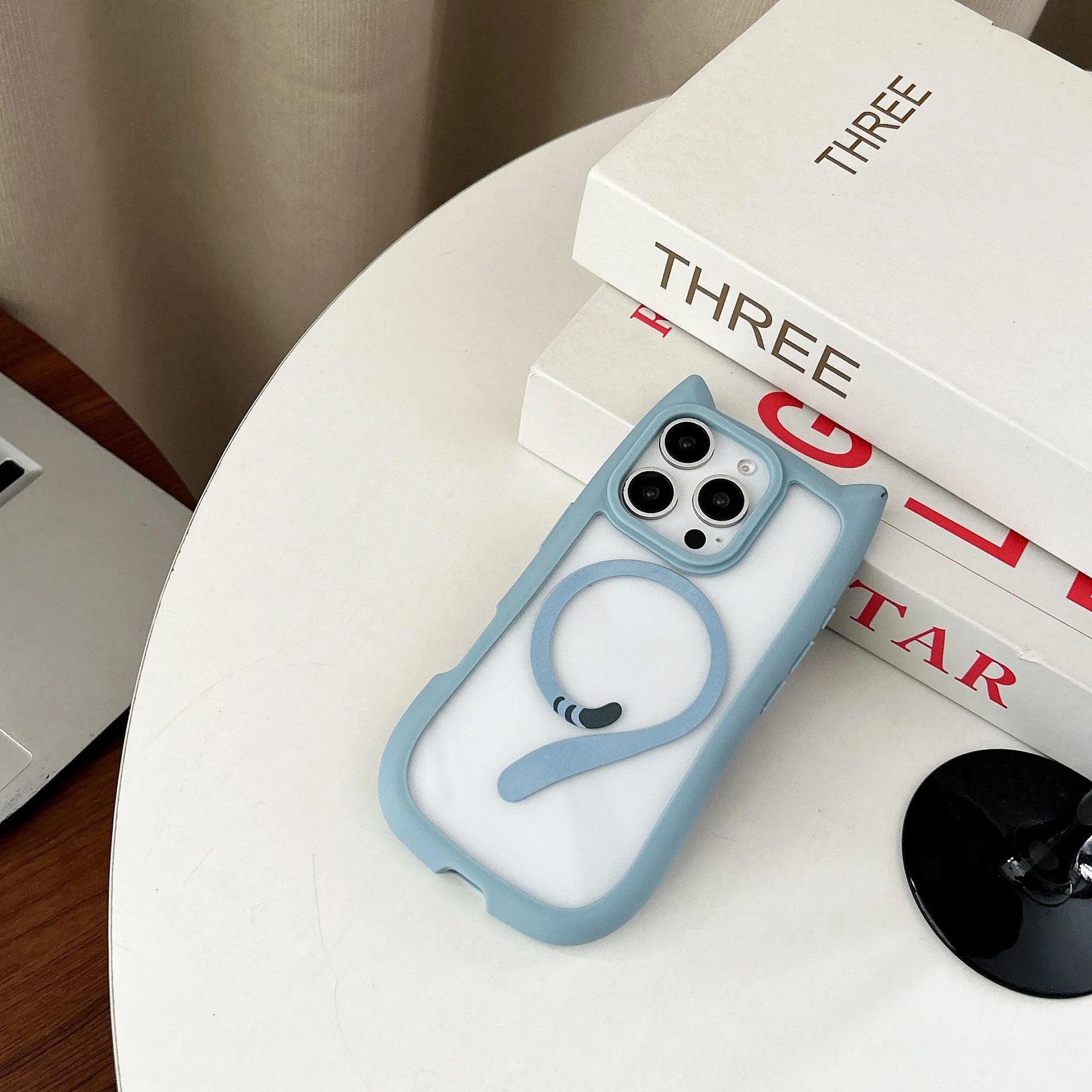 Transparent acrylic TPU phone case for iPhone 17 series in black colour, showing magnetic ring feature.