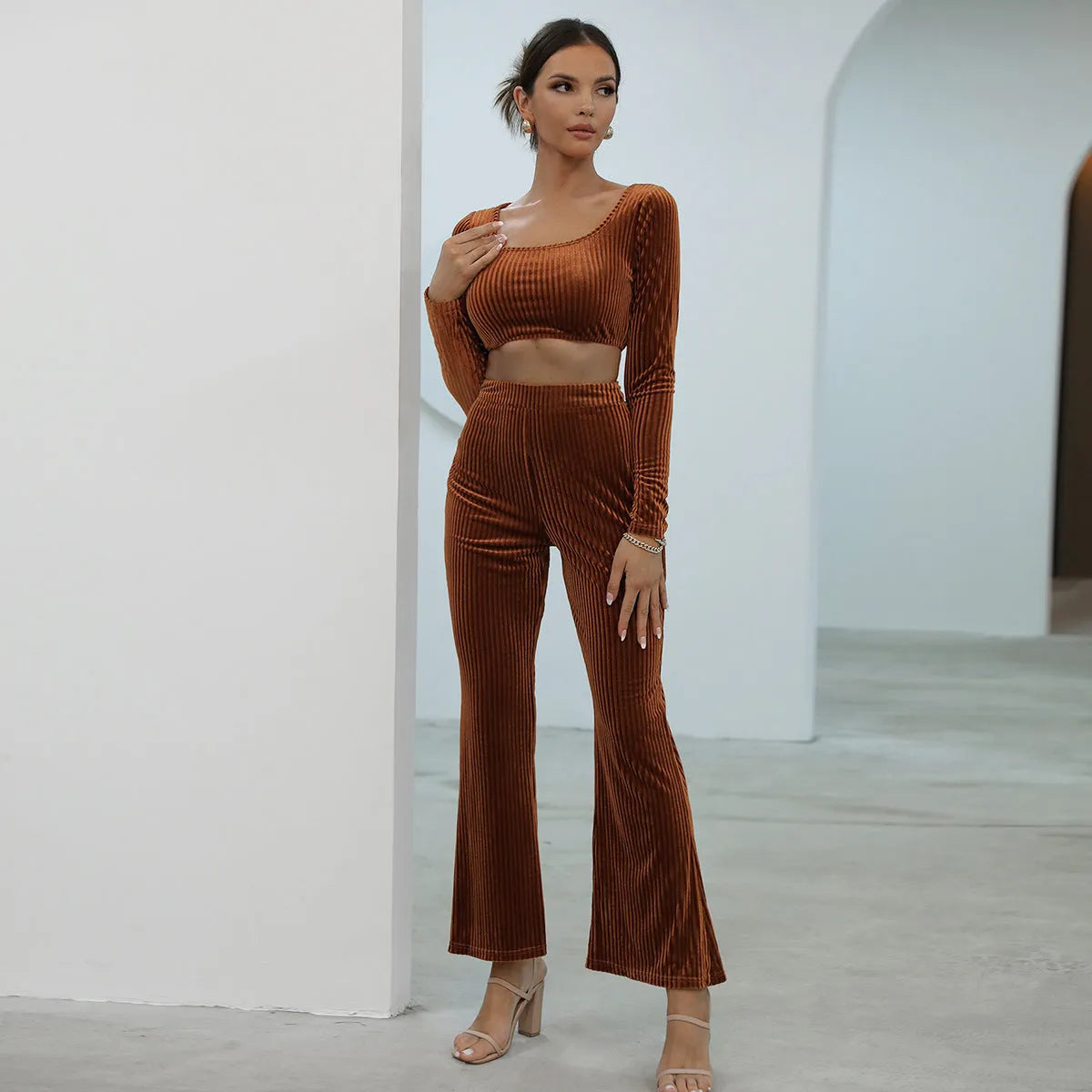 Caramel coloured long sleeve sweater and matching trousers casual set laid flat