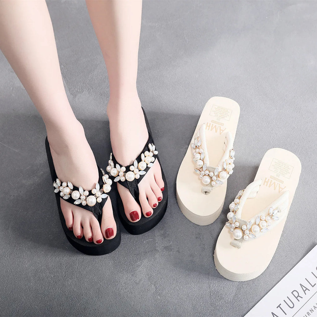 Women's black cotton high-heeled flip-flop sandals showing elevated sole and cloth upper