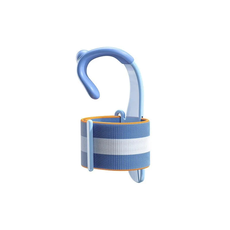 Blue anti-hook pen control corrector wrist brace for children's handwriting practice on a desk.