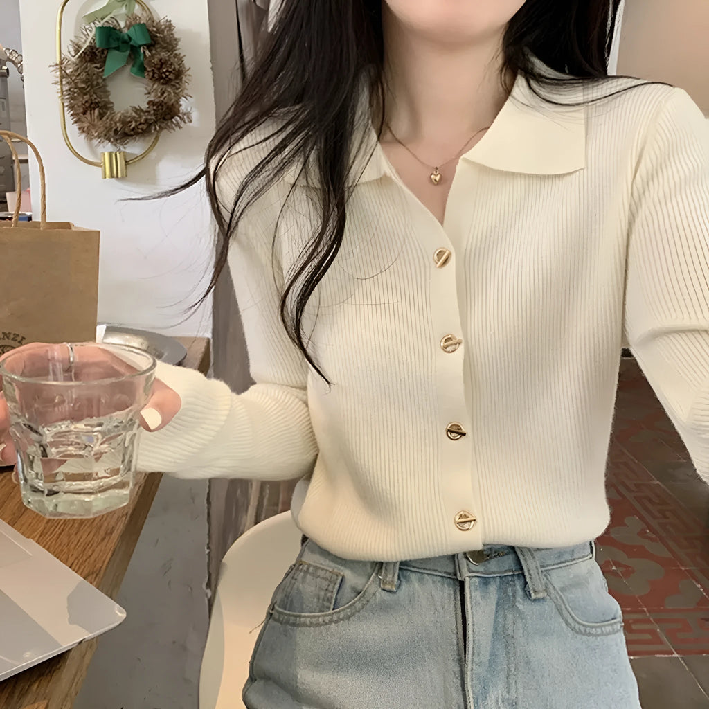 Long-sleeve viscose knit cardigan in loose fit, shown in beige colour on hanger.