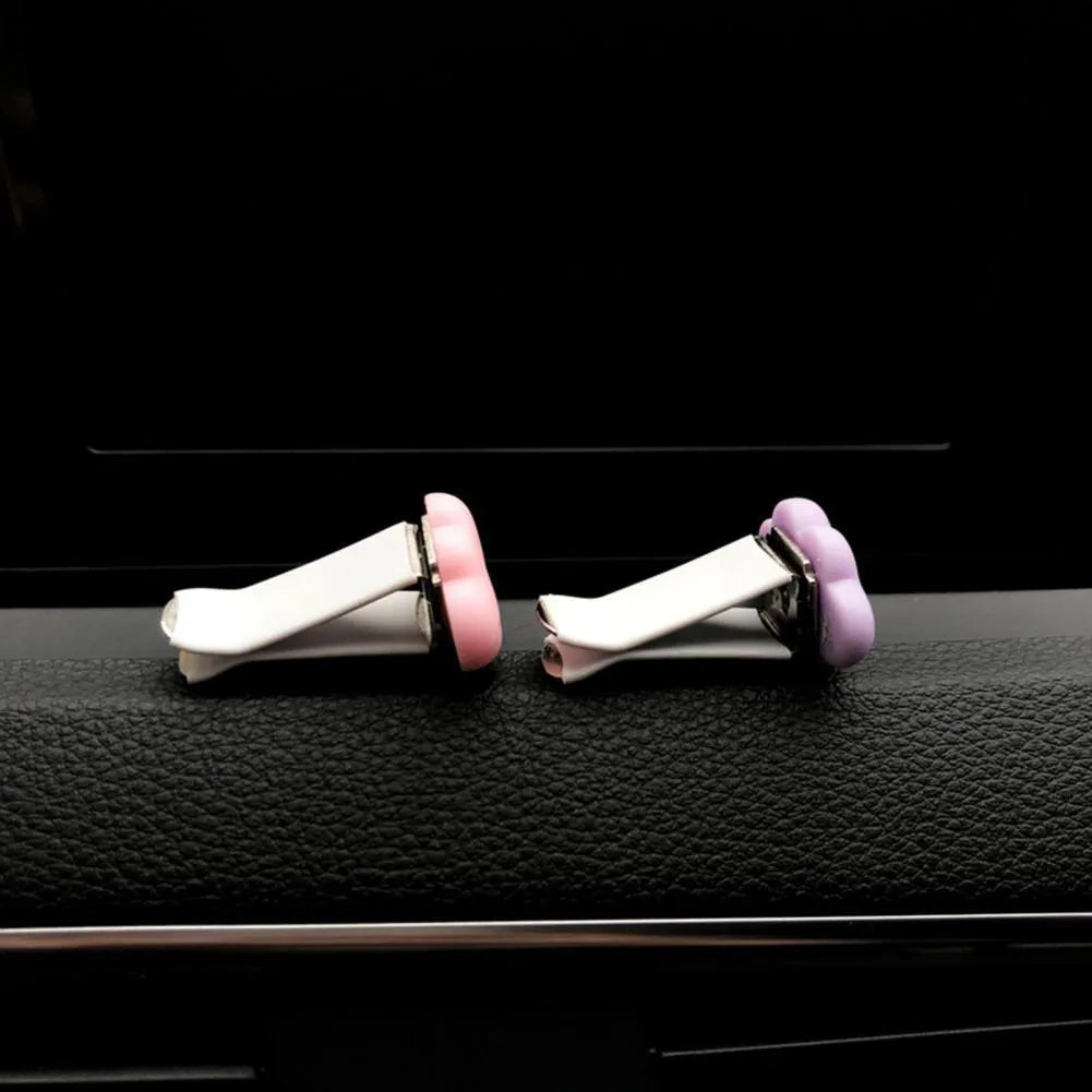 Resin cartoon Baiyun design car air vent fragrance clip in light green colour.
