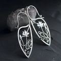 Silver retro style alloy earrings with lotus vine and geometric flower design featuring round rhinestones