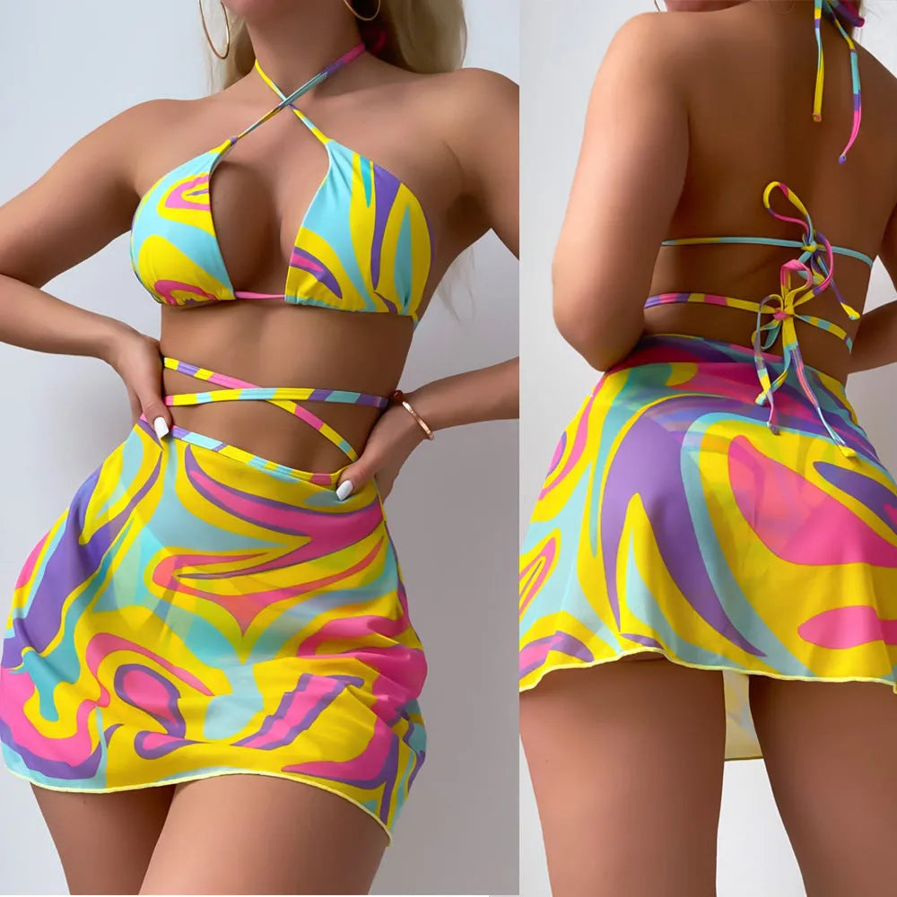 Yellow striped halter-neck swimsuit with lace-up front, includes matching skirt and shorts