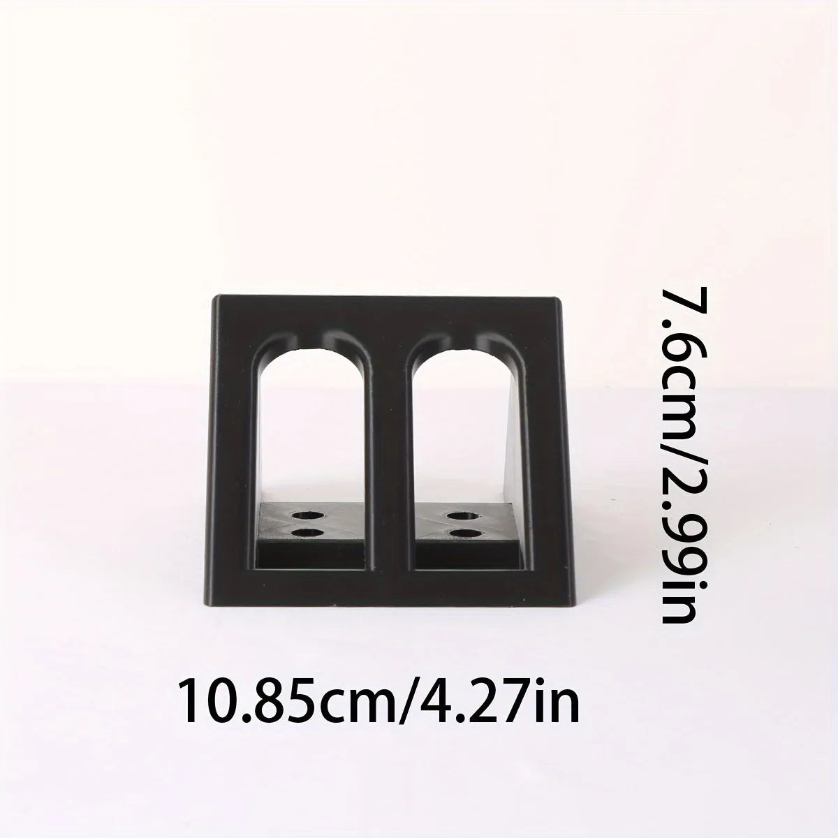 Black plastic pistol stand with punk-style design for displaying model firearms