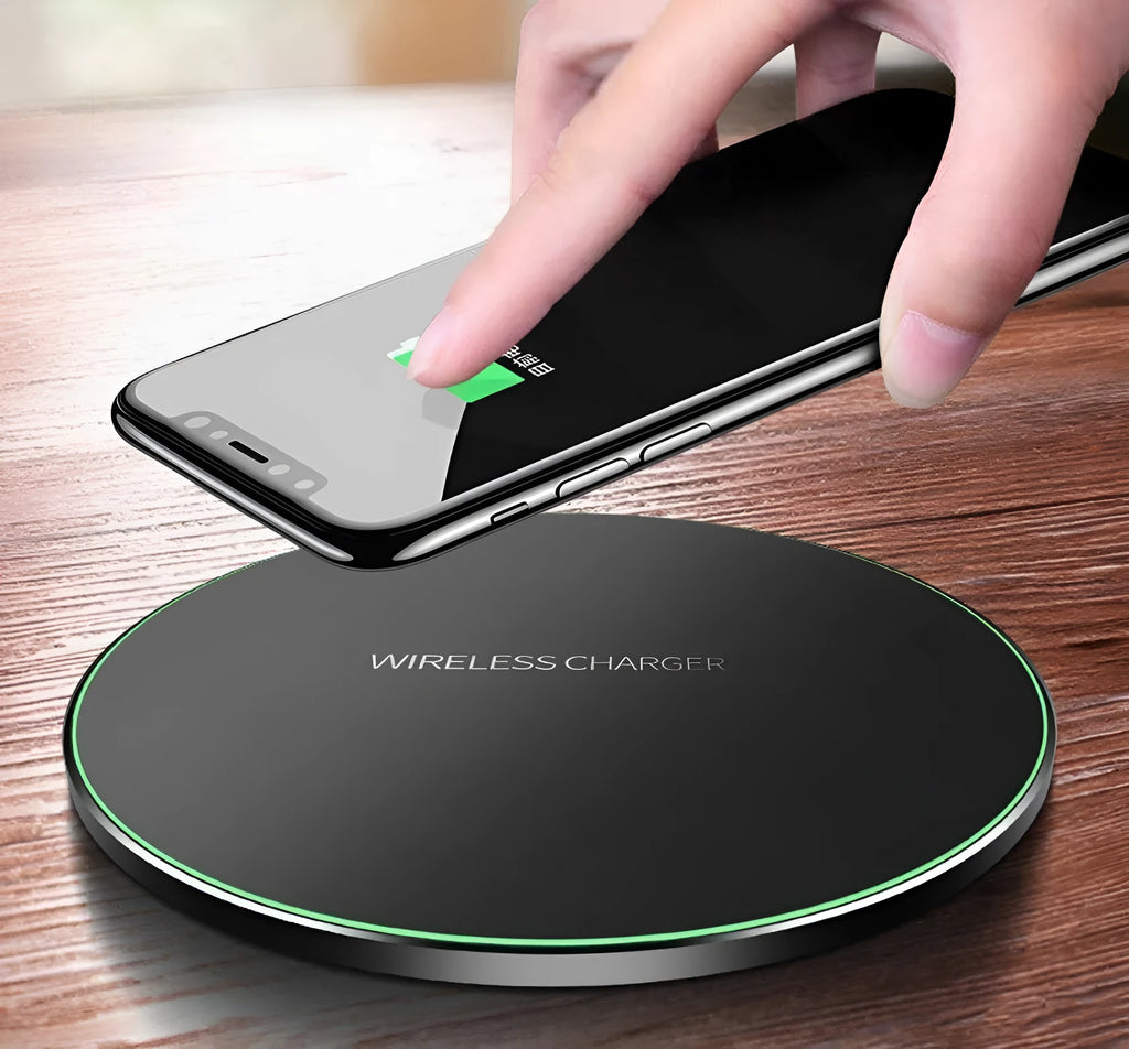 Ultra-thin black square wireless fast charger with USB cable on a table