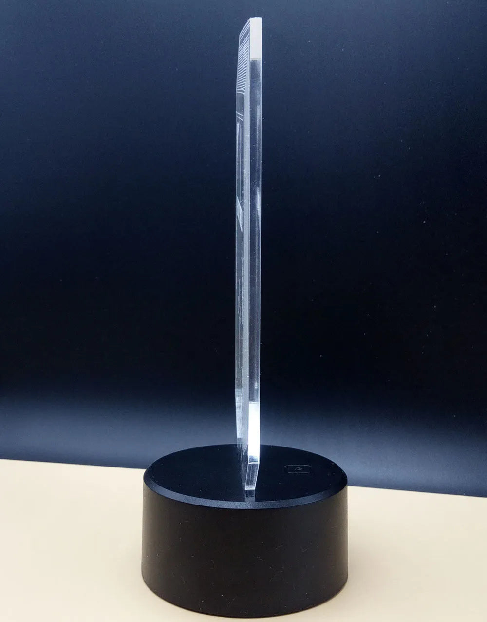3D rose design night light on a black base showing multicolour gradient illumination.