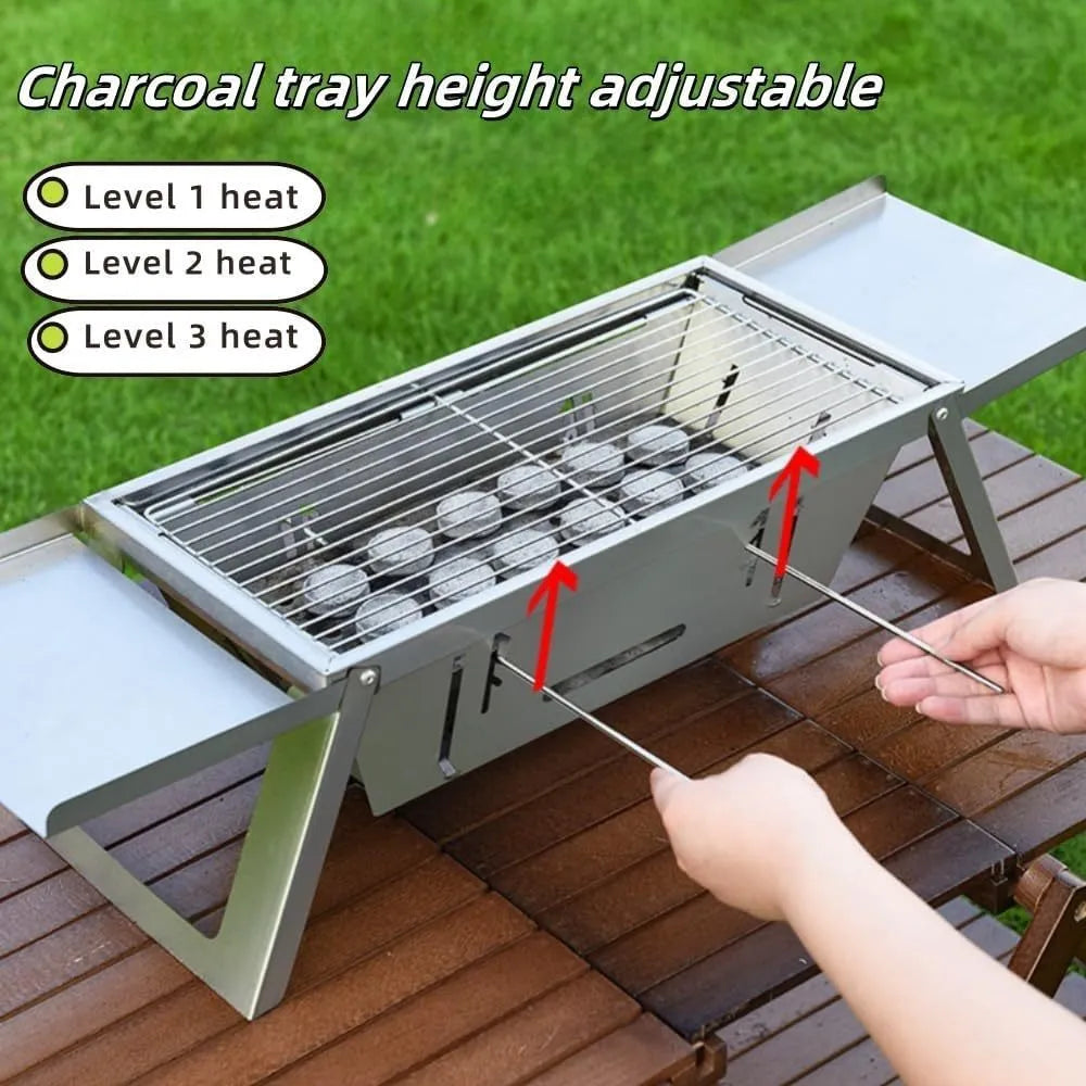 Small portable folding metal charcoal grill for outdoor barbecues.