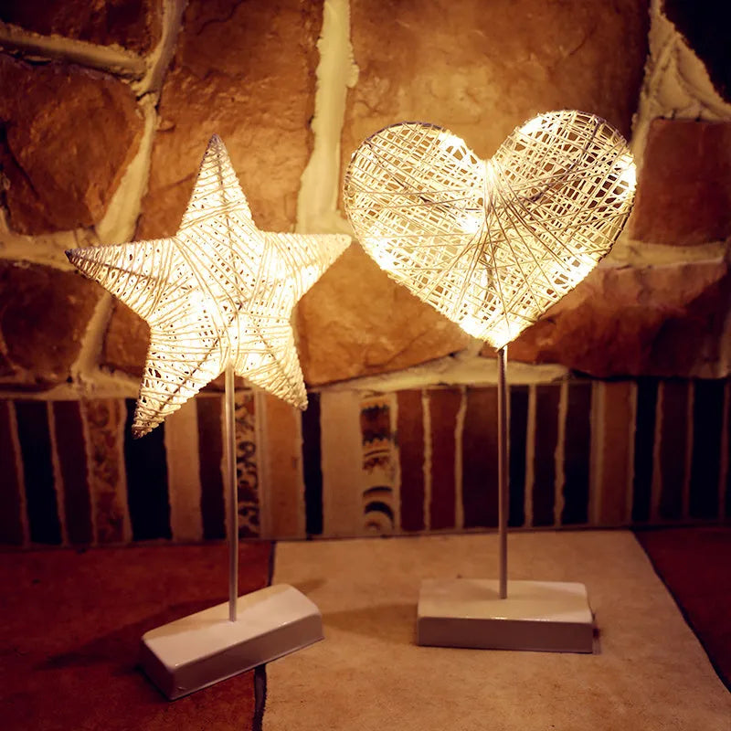 Rattan and PC LED decorative lamp in star, heart, or moon shape on a table.
