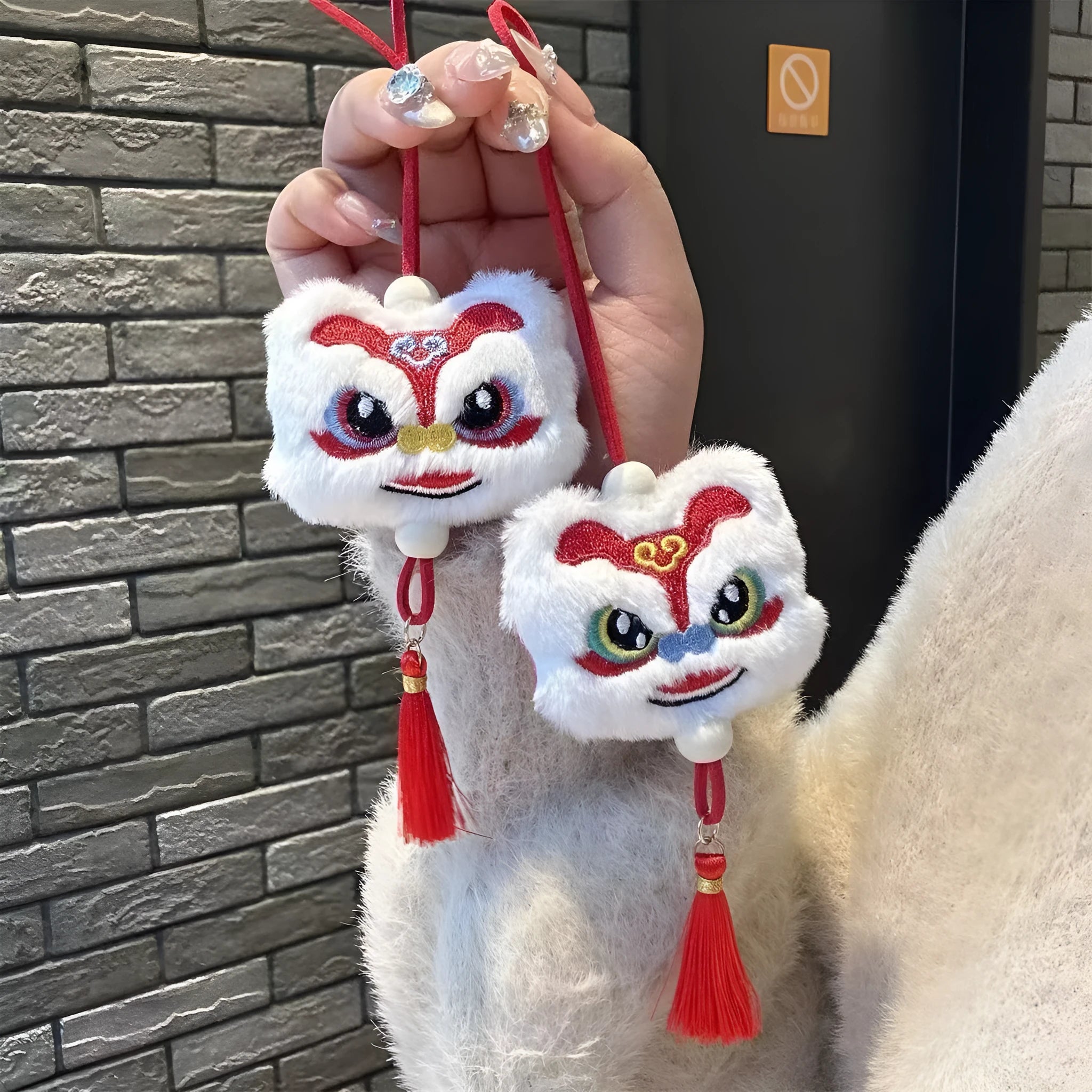 Handmade blue and yellow Chinese style plush lion keychain ornament with tassel and star stone.