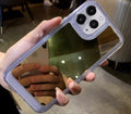 Silver mirror iPhone 15 protective case with soft rubber acrylic texture and makeup mirror element