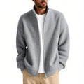 Loose fit men's cardigan sweater in an acrylic blend fabric on a hanger