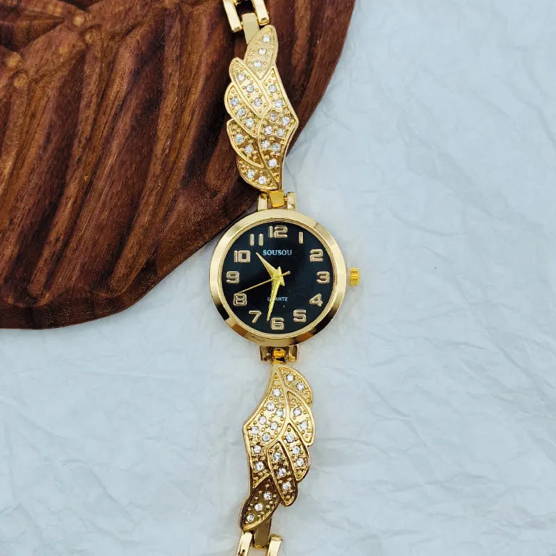 Stainless steel women's watch with round dial showing gold surface option and vachette clasp
