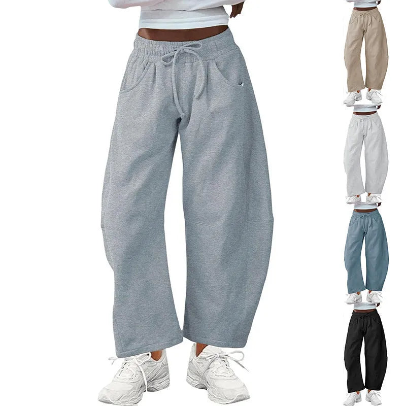 Women's loose cropped sweatpants with drawstring waist and side pockets in street fashion style