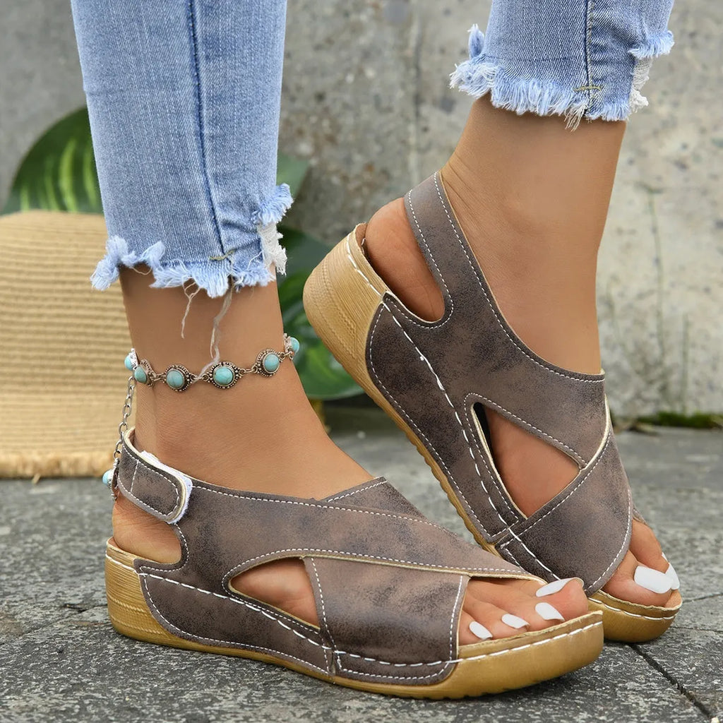 Roman platform sandals with a removable skirt and Velcro strap in a khaki colour.