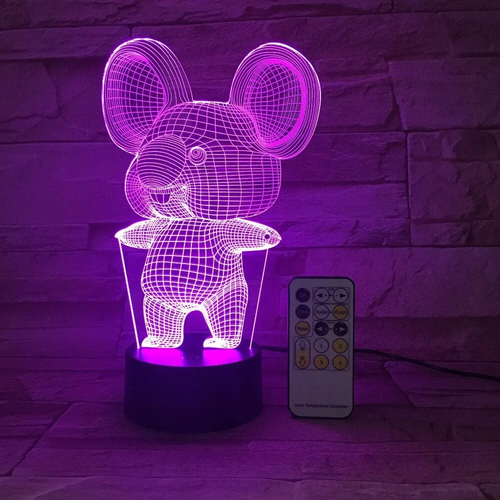 Black koala-shaped LED night light with remote control showing multiple colour illumination options