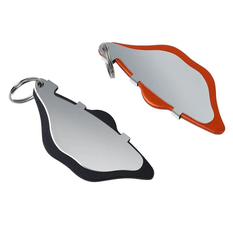 Mountain bike disc brake pads in black and orange colours with adjustment flap