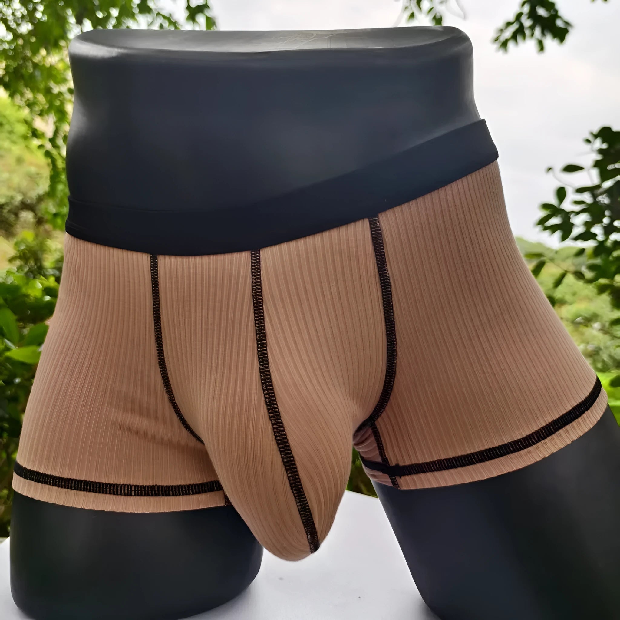 Men's solid colour boxer shorts in breathable fabric on a size chart showing L, XL, 2XL, and 3XL.
