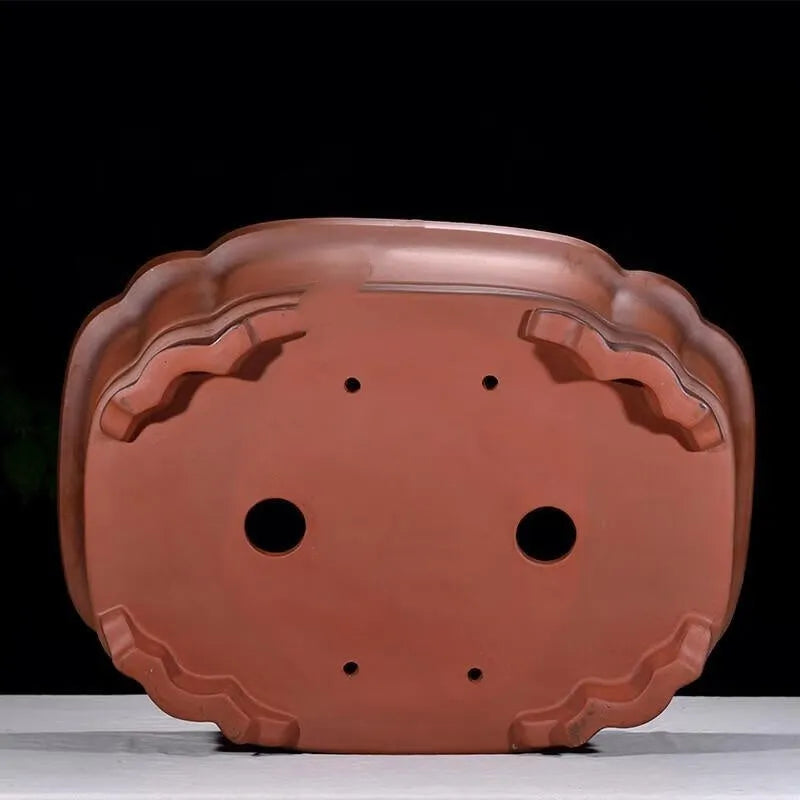 Large oval antique-finish purple clay flowerpot with carved crabapple tree design.