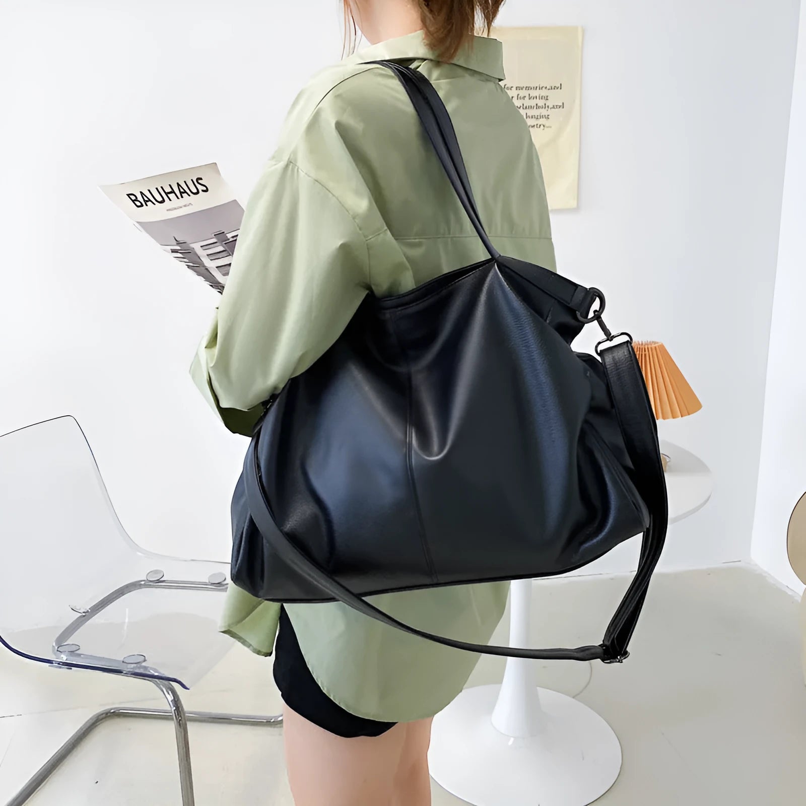 Large soft PU messenger bag in khaki colour with a long shoulder strap, shown open to reveal inner phone pocket.