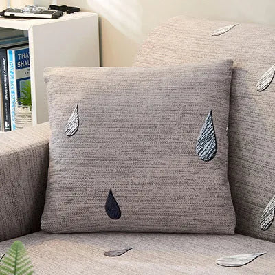 Geometric print stretch sofa slipcover on a double seat sofa