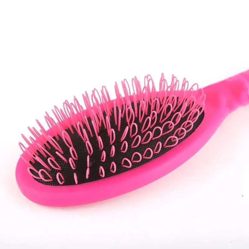 Ring tooth hairdressing airbag comb in ABS plastic measuring 22cm by 6cm