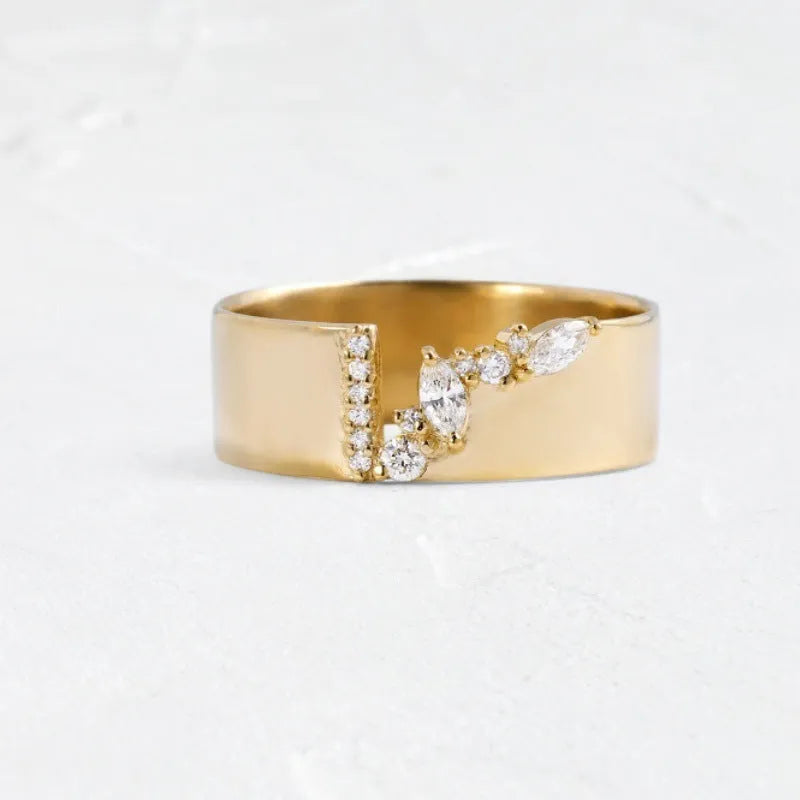 Gold electroplated women's ring with zircon detail on a copper band, showing sizing options.
