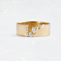 Gold electroplated women's ring with zircon detail on a copper band, showing sizing options.