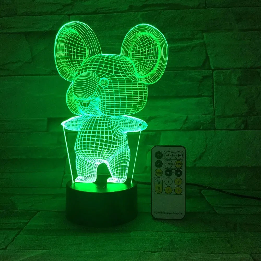 Black koala-shaped LED night light with remote control showing multiple colour illumination options