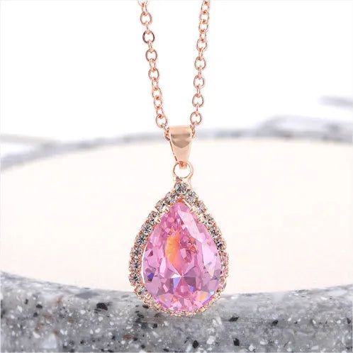 Rose gold water drop necklace with geometric rhinestone pattern in pink colour