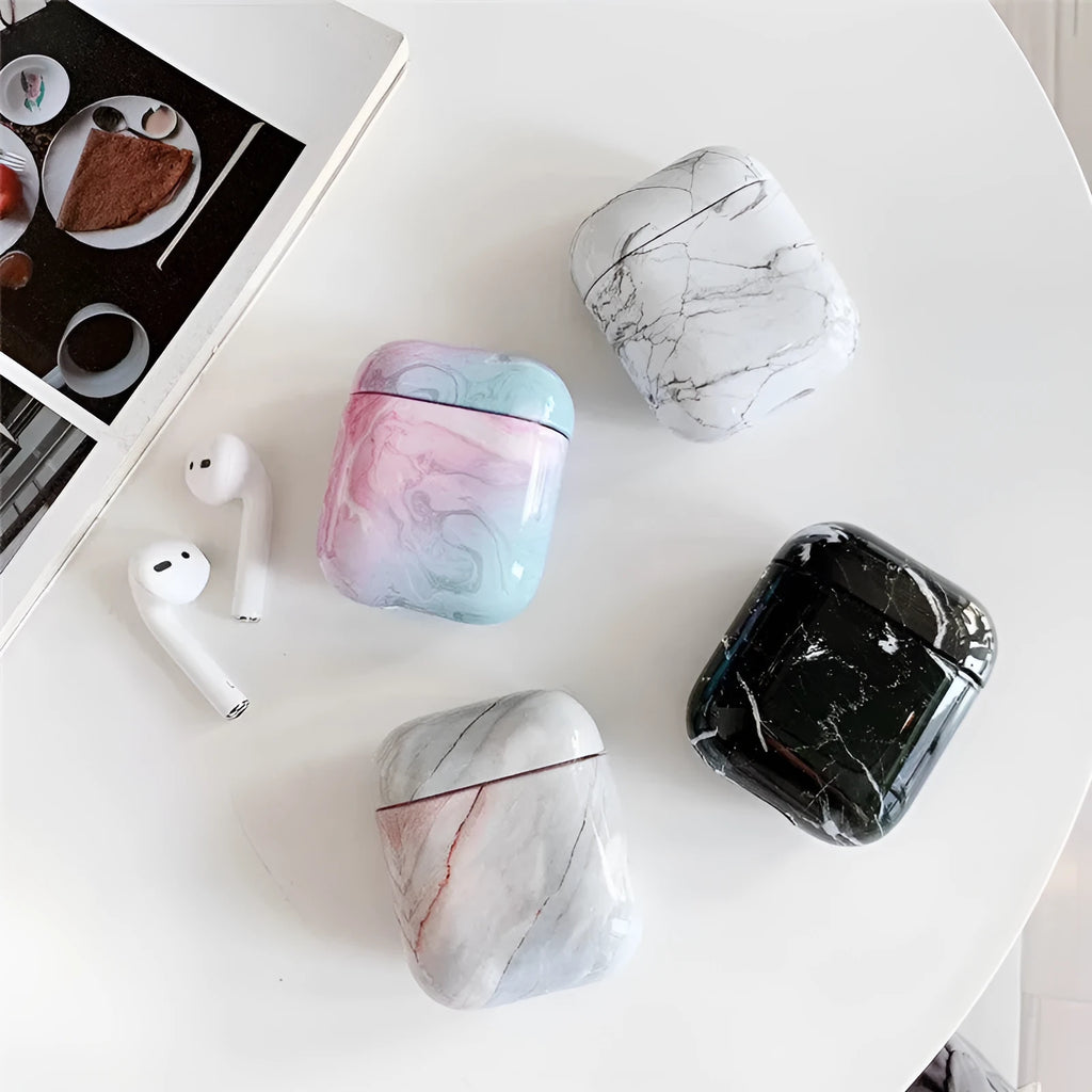 White marble pattern hard case covering an Apple AirPods charging box.