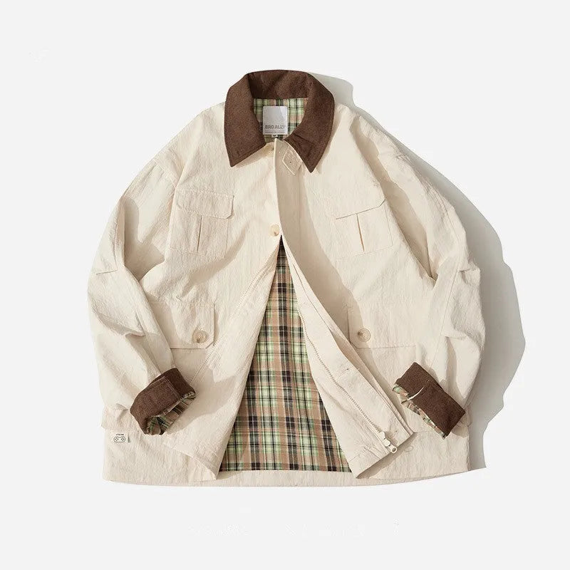 Green casual jacket with contrast trim and side seam pockets on a hanger