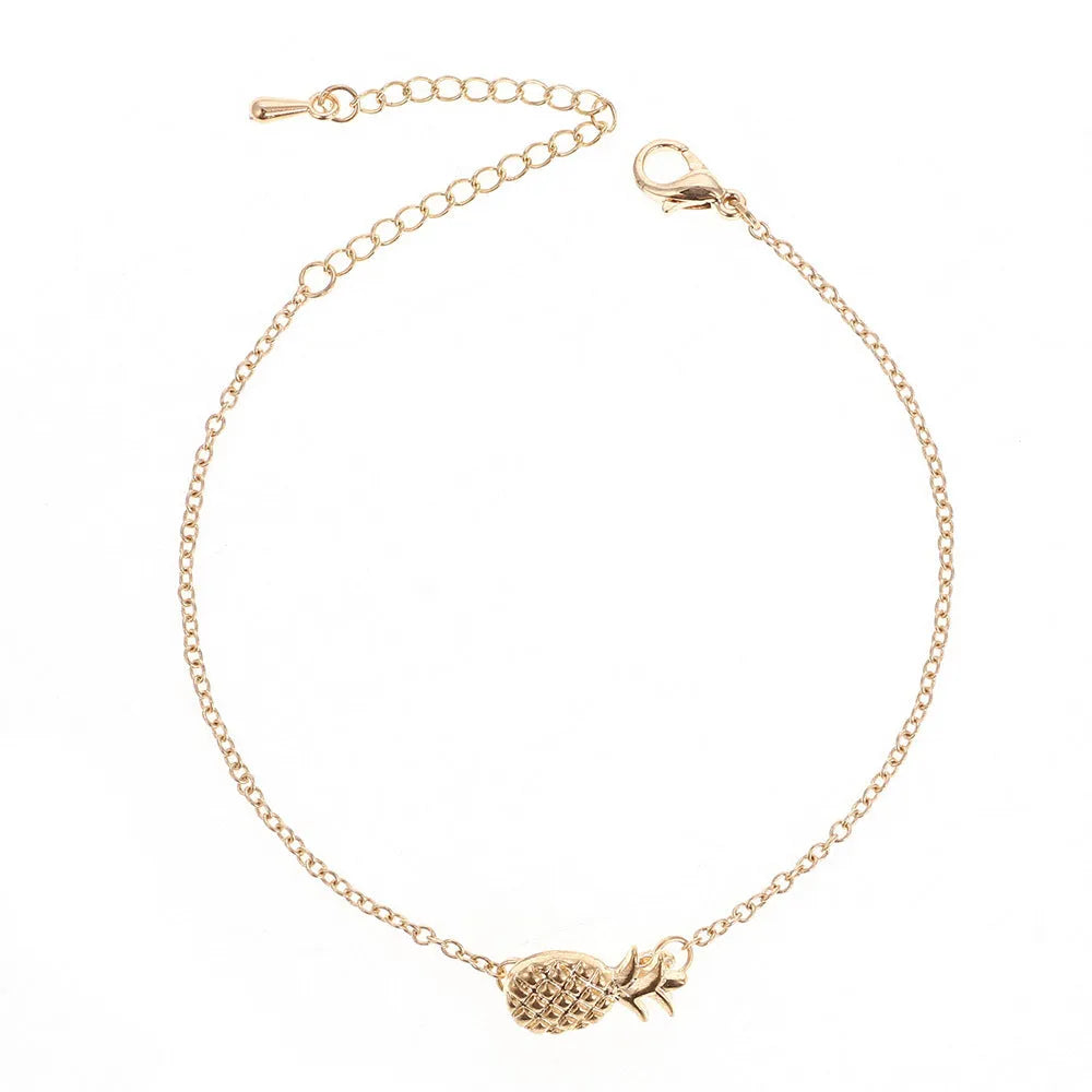 Gold or silver alloy bracelet with a small pineapple charm on an adjustable chain.