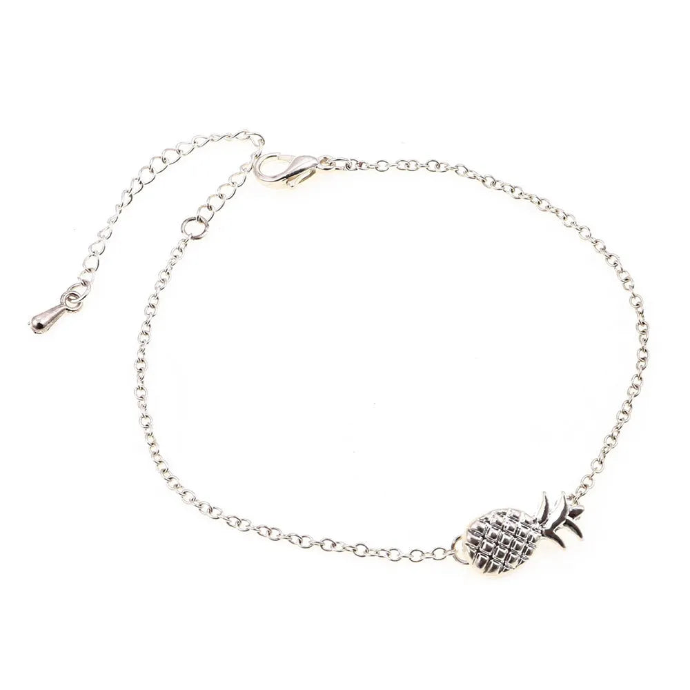 Gold or silver alloy bracelet with a small pineapple charm on an adjustable chain.