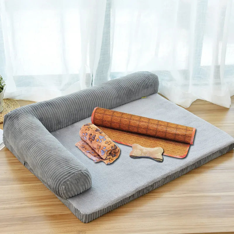 Corduroy pet dog bed with bolster sides on a non-slip base, shown in grey colour.