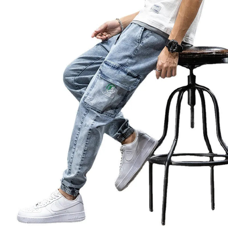 Men's loose fit cargo jeans in blue with straight leg and front pockets.
