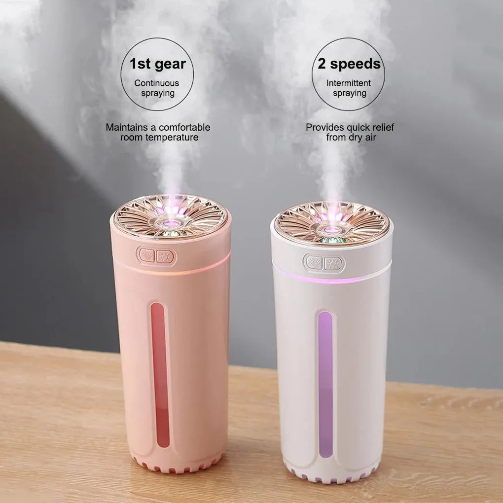 Black USB rechargeable ultrasonic humidifier with LED lights on a car cup holder